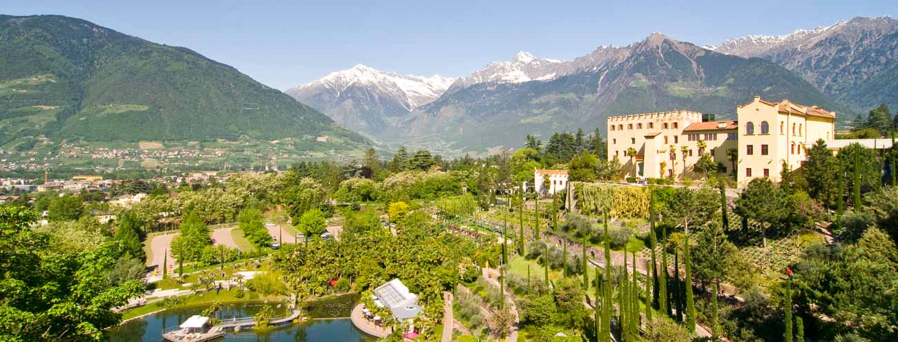 The Gardens of Trauttmansdorff and the associated castle on a sunny day